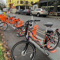 biketown bike share bikes are parked at a station