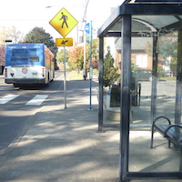 bus stop with shelter bench and crosswalk