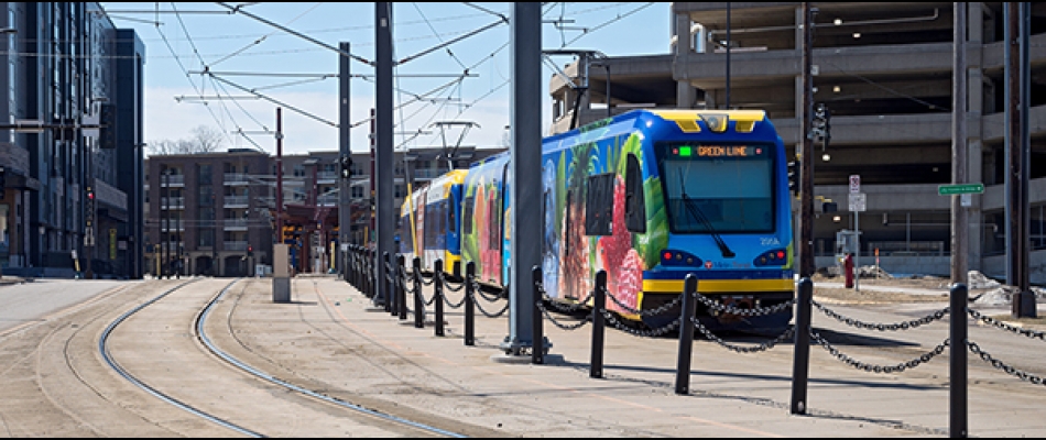A light rail train on tracks