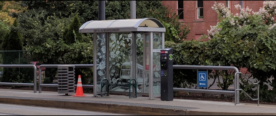 Bus stop with trees and buildings